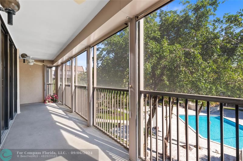 a view of a balcony with wooden floor