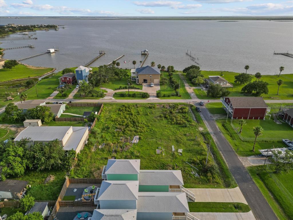 an aerial view of multiple houses with yard