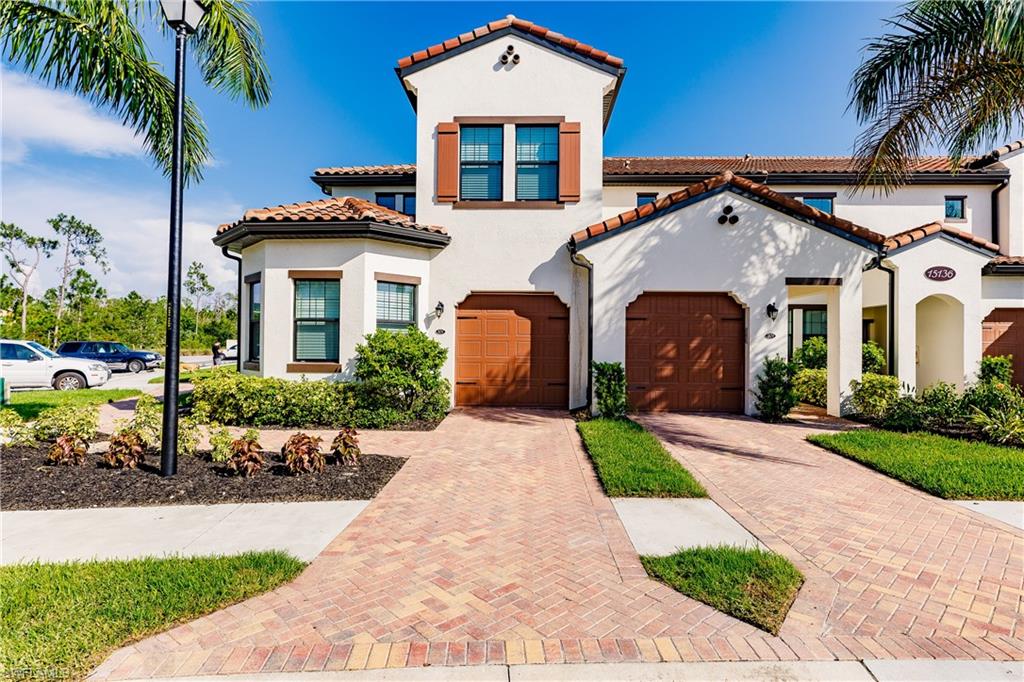 Mediterranean / spanish-style house with a garage