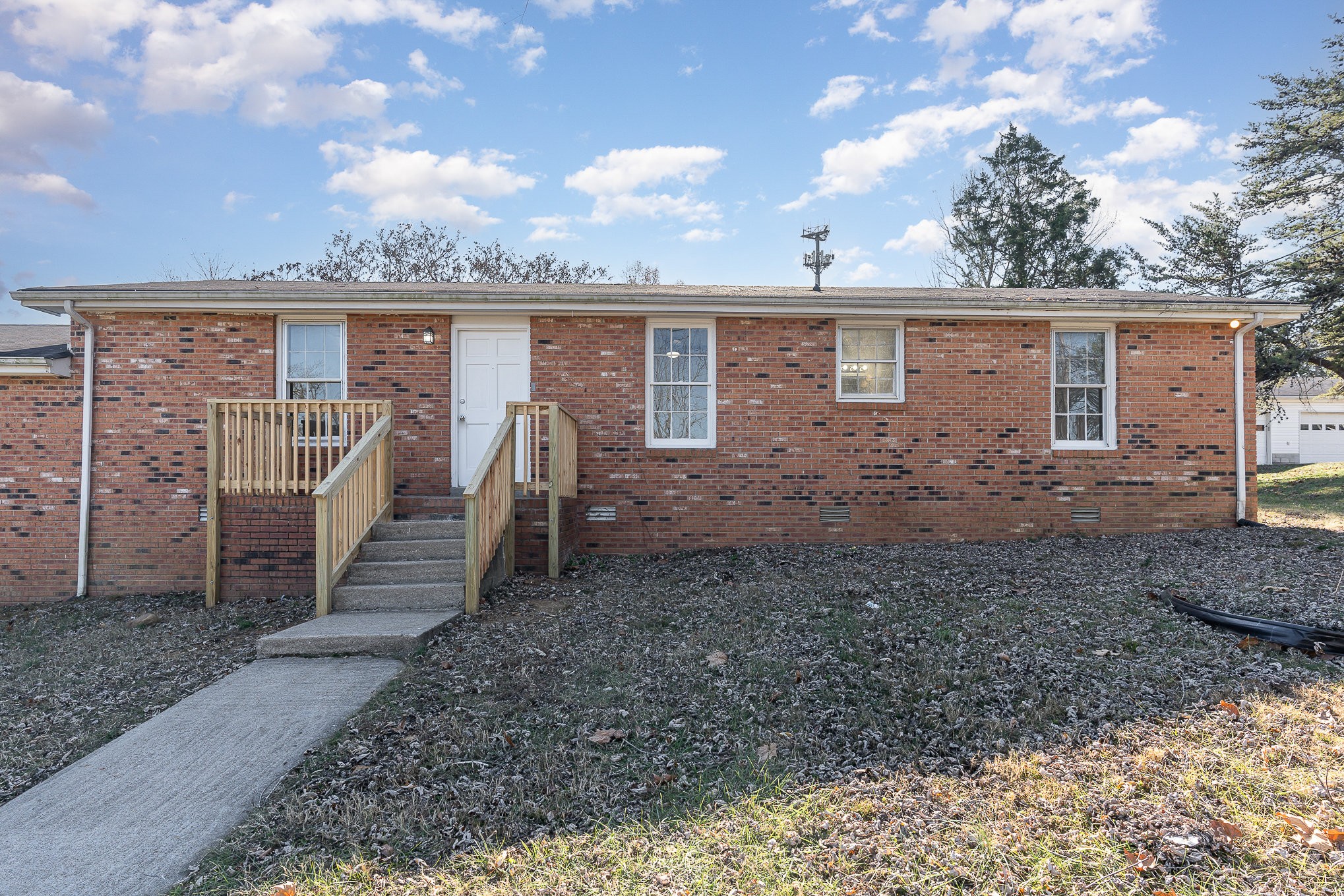 a view of a yard in front of a house