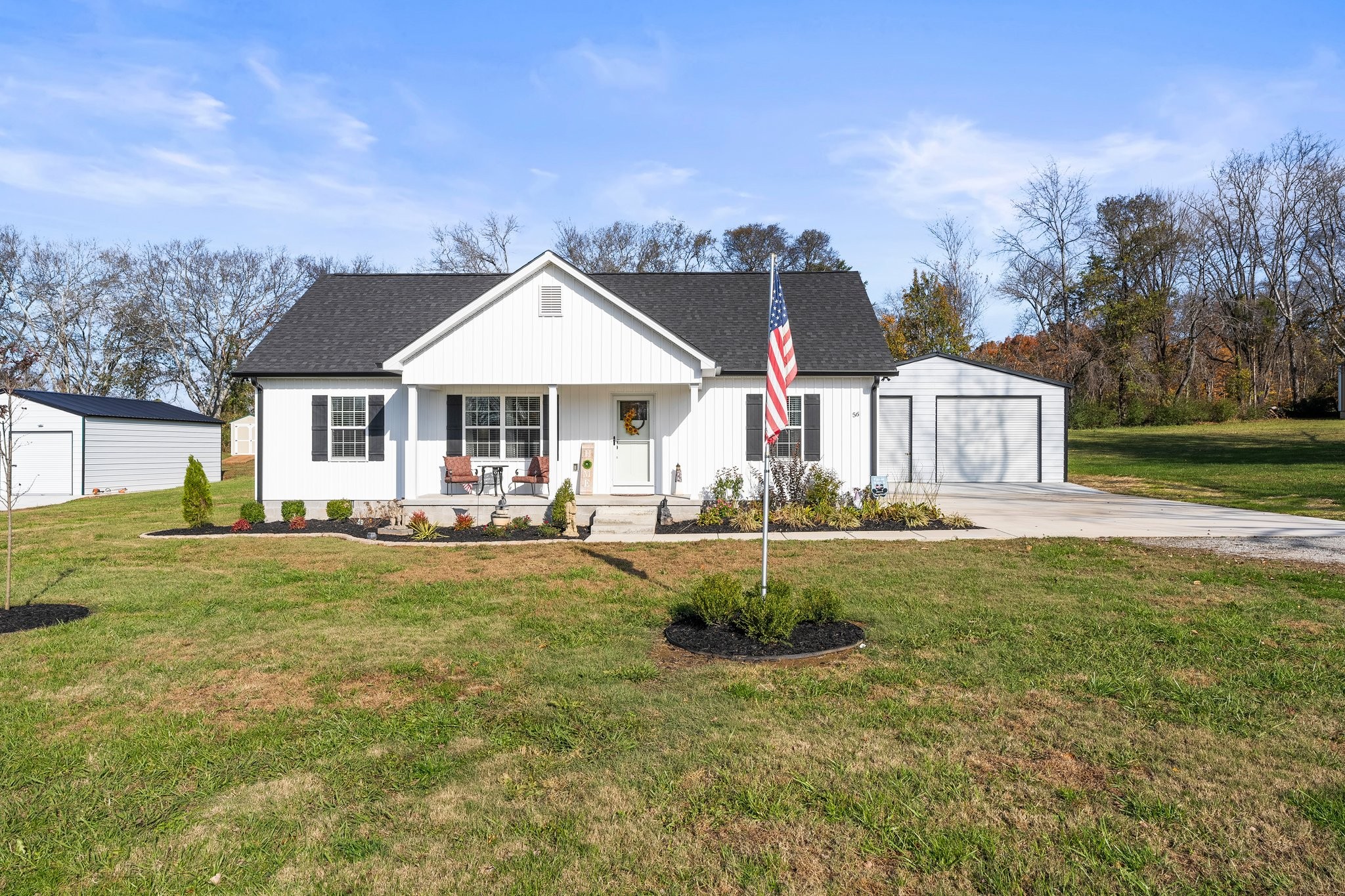 Front view of house with detached garage.