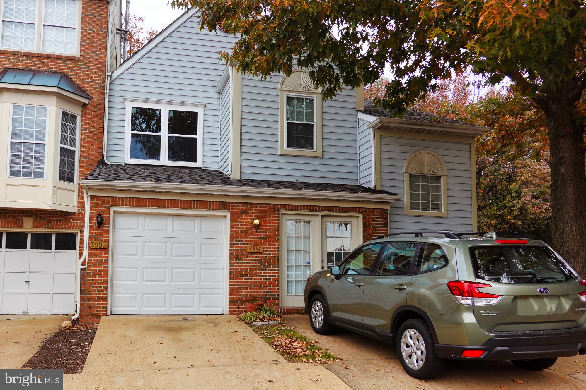 a car parked in front of a house