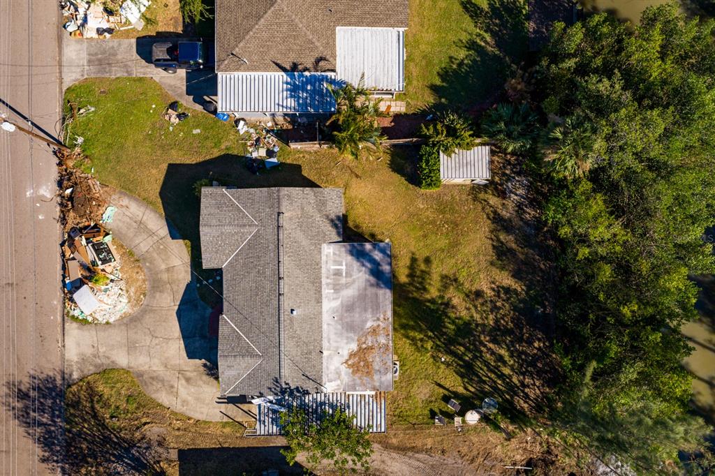 an aerial view of a house with a yard and garden