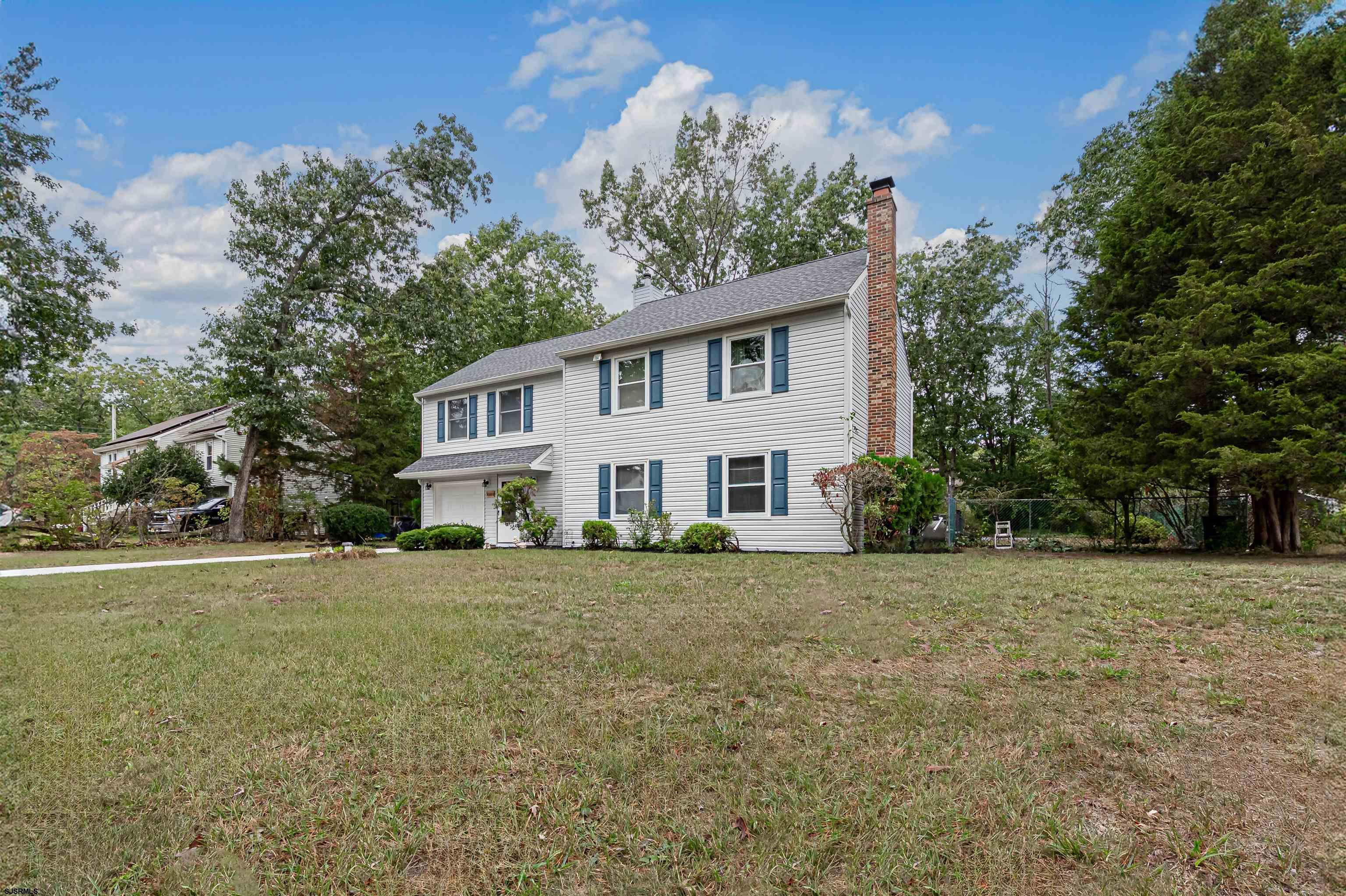 a house with trees in the background