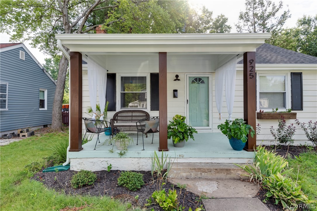 a front view of a house with yard and outdoor seating