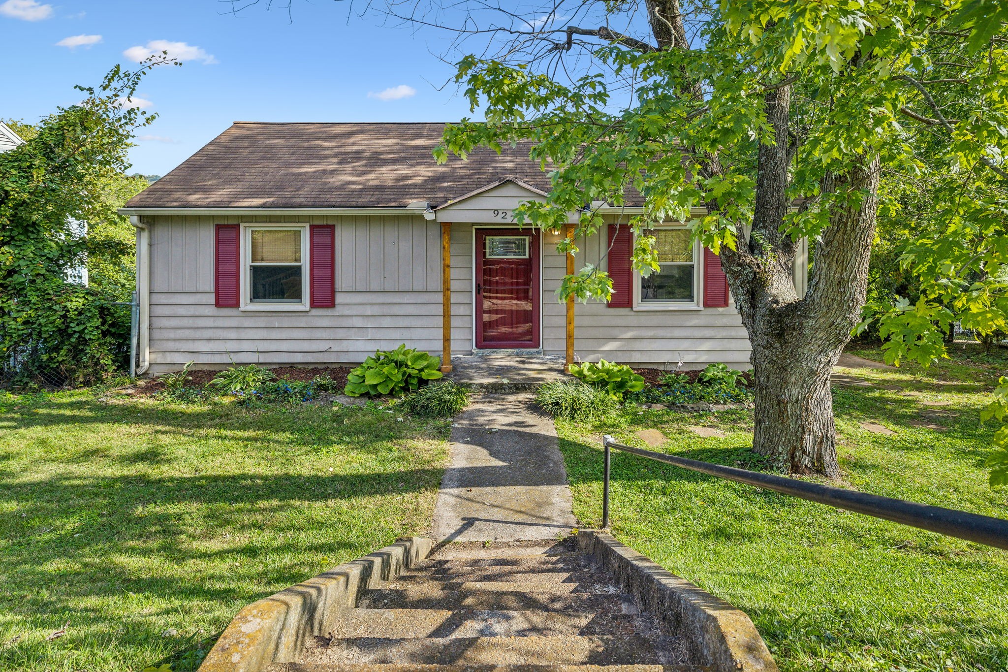 a front view of a house with garden