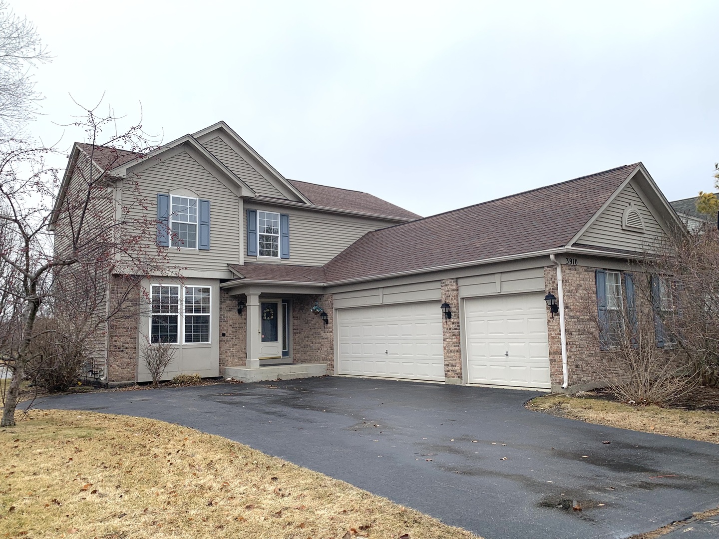 front view of a house with a parking space