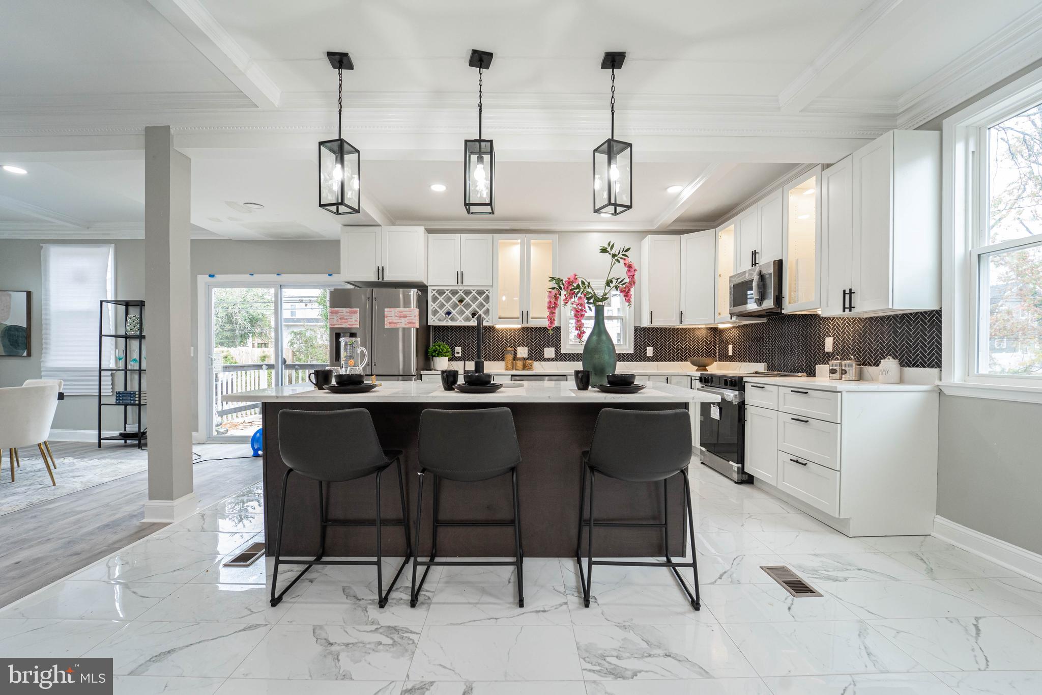 a kitchen with cabinets a sink and appliances