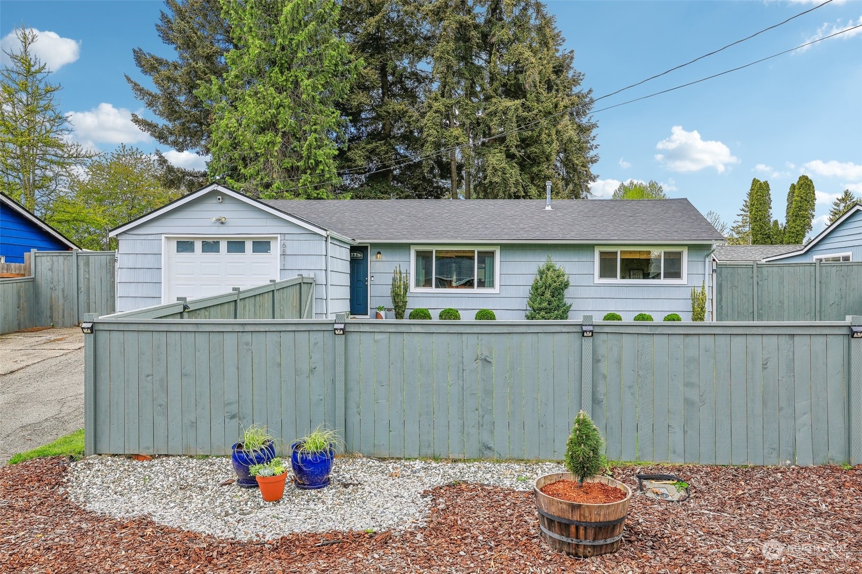 a front view of a house with garden