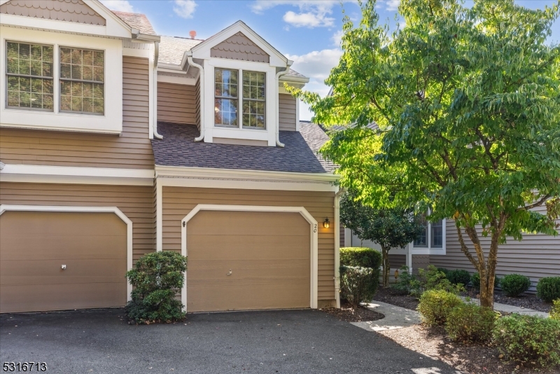 a front view of a house with a garage