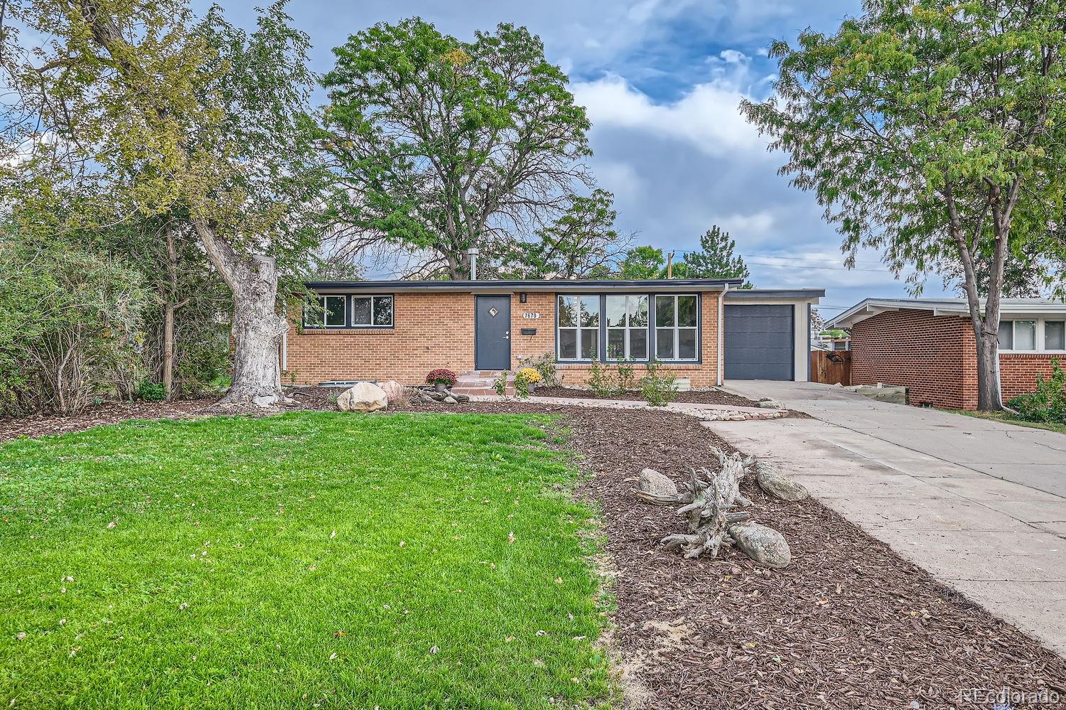 front view of a house with a yard