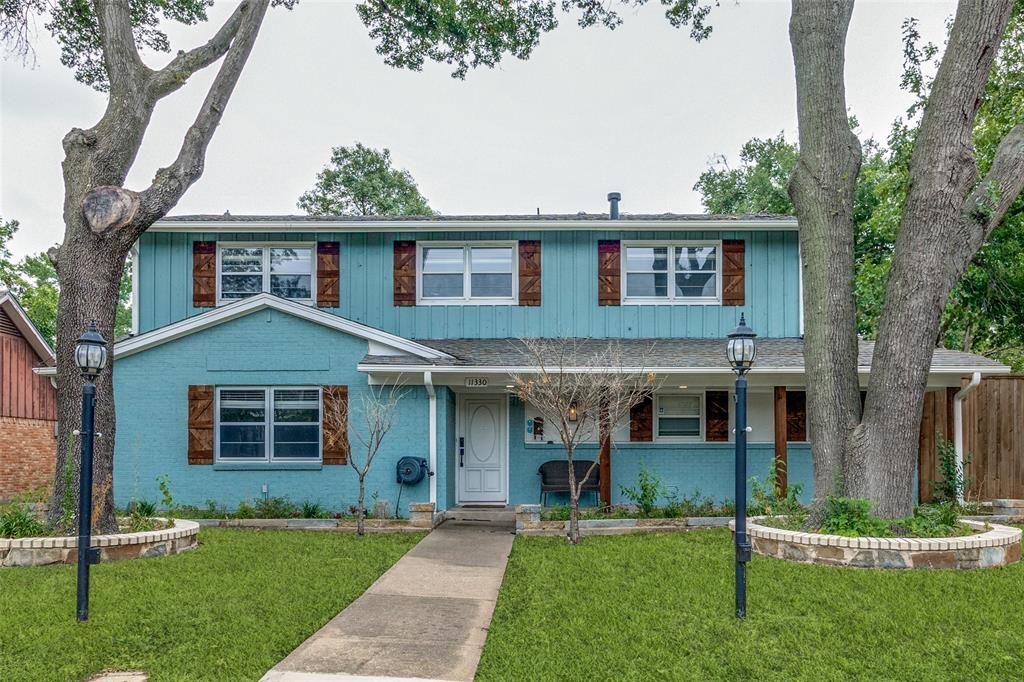 front view of a house with a yard