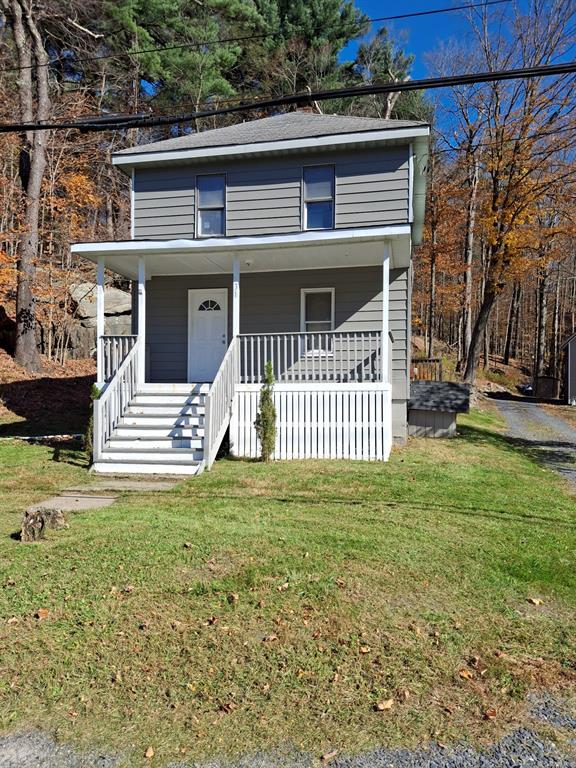 a front view of a house with a yard