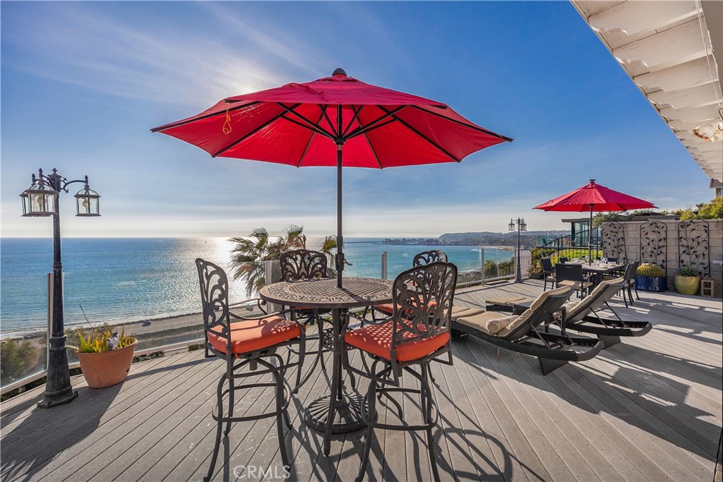 an outdoor space with furniture and umbrella