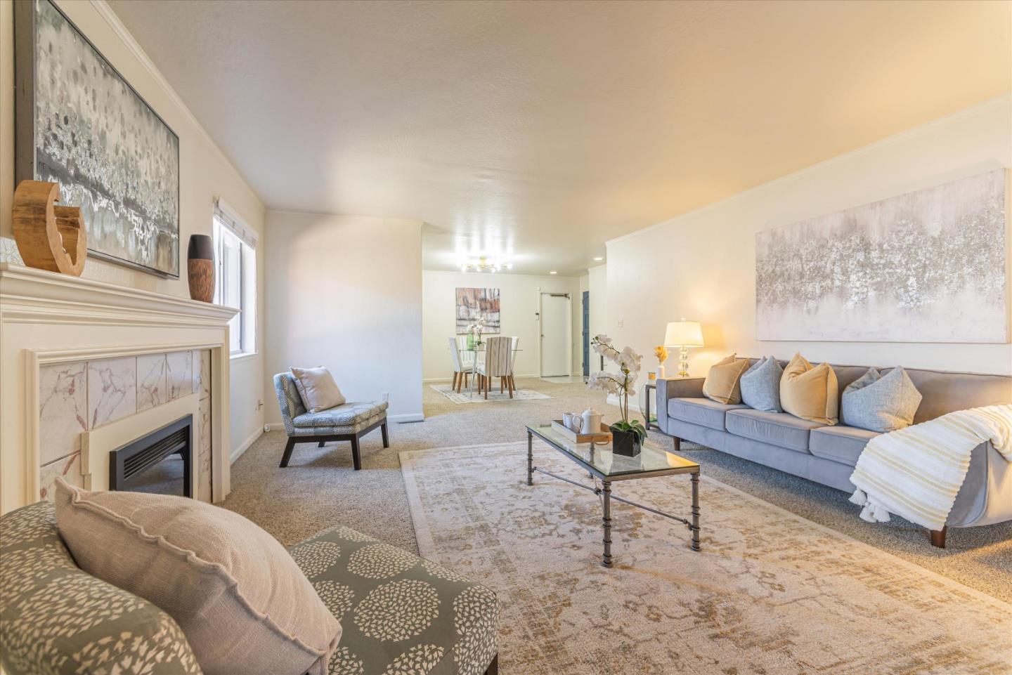 a living room with furniture fireplace and a fireplace