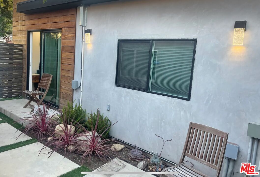 a potted plant sitting in front of a house