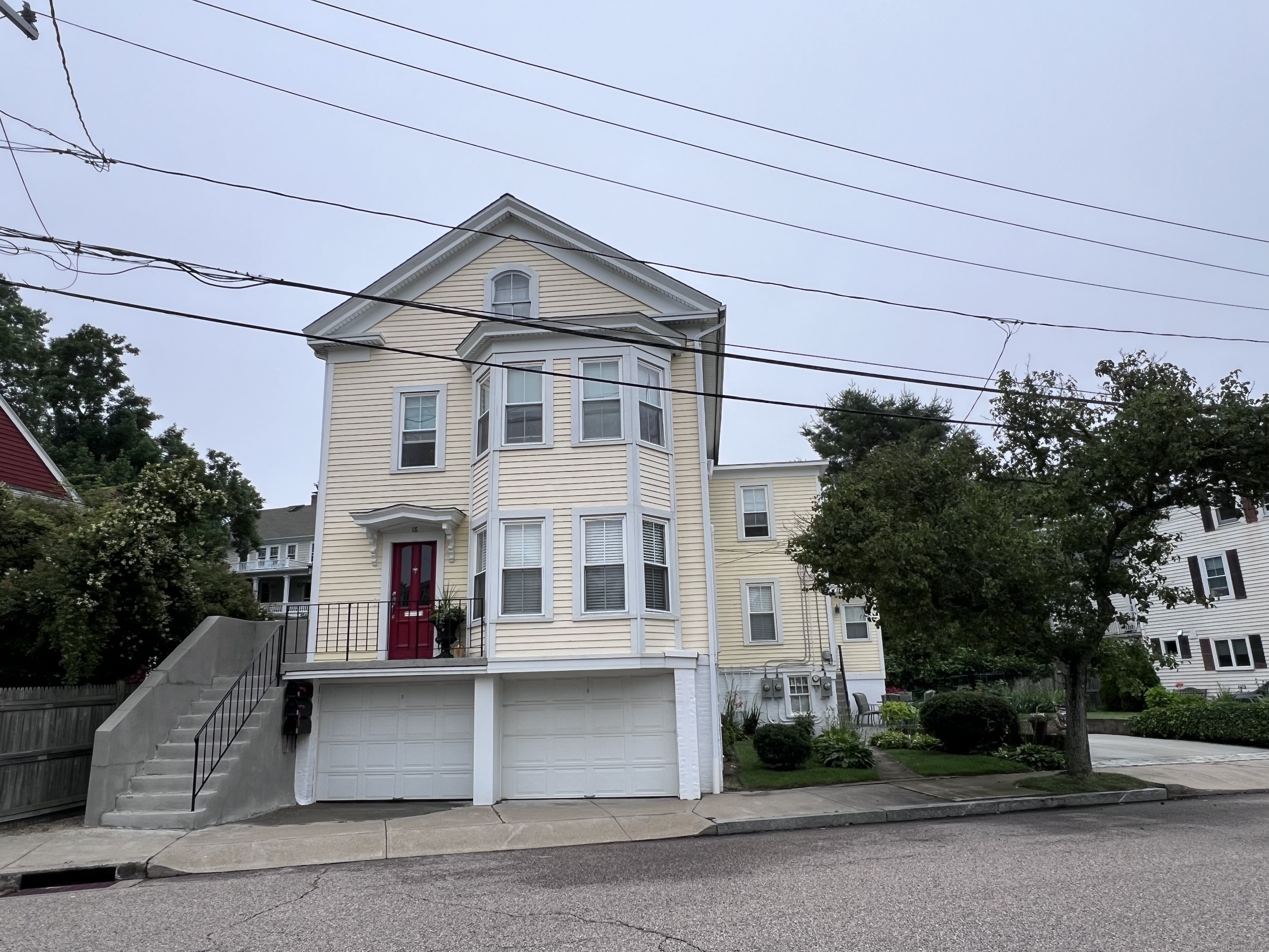 a front view of a house with a yard and garage