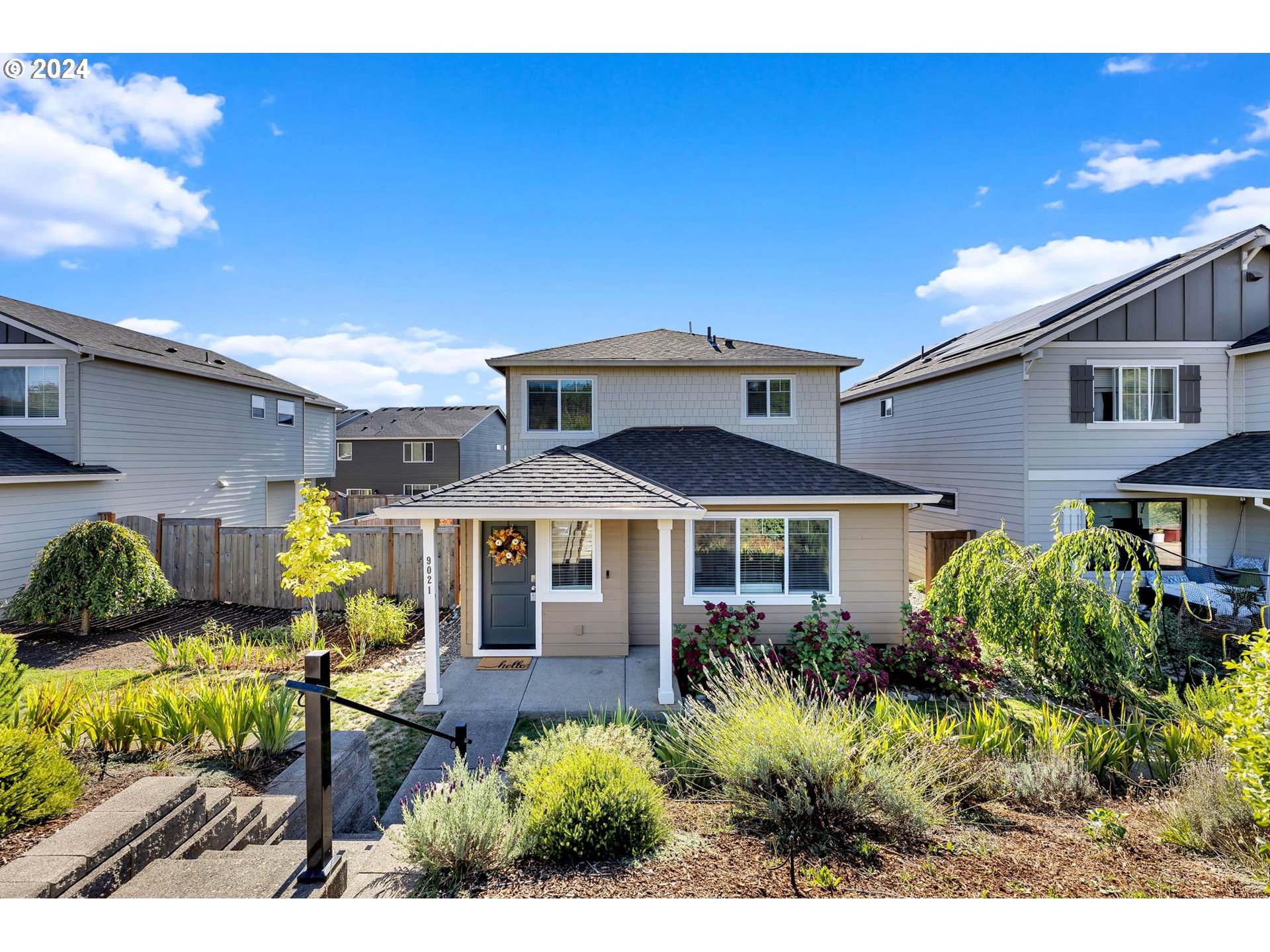 a front view of a house with patio outdoor seating and entertaining space