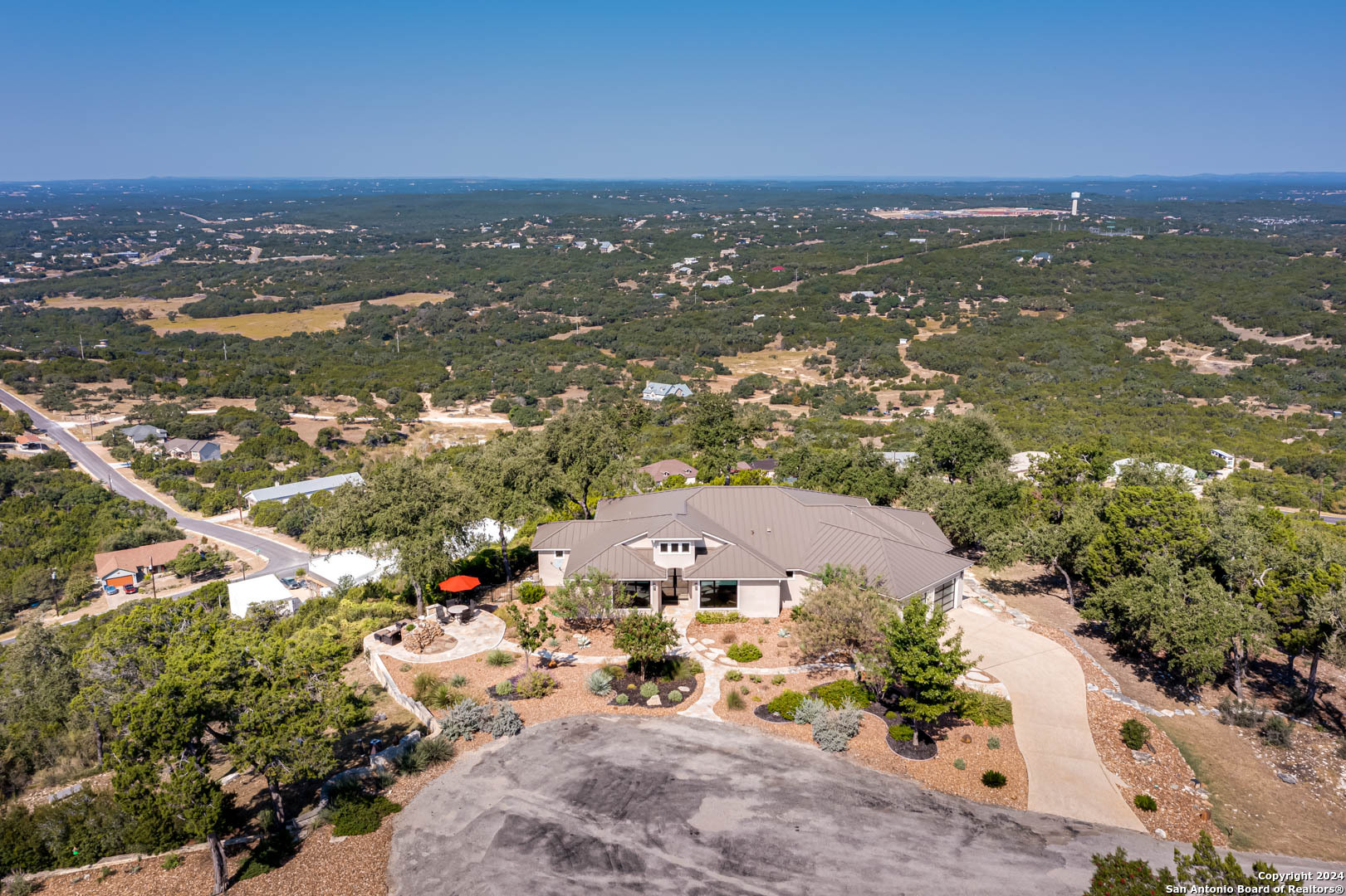 an aerial view of a house with a lake view