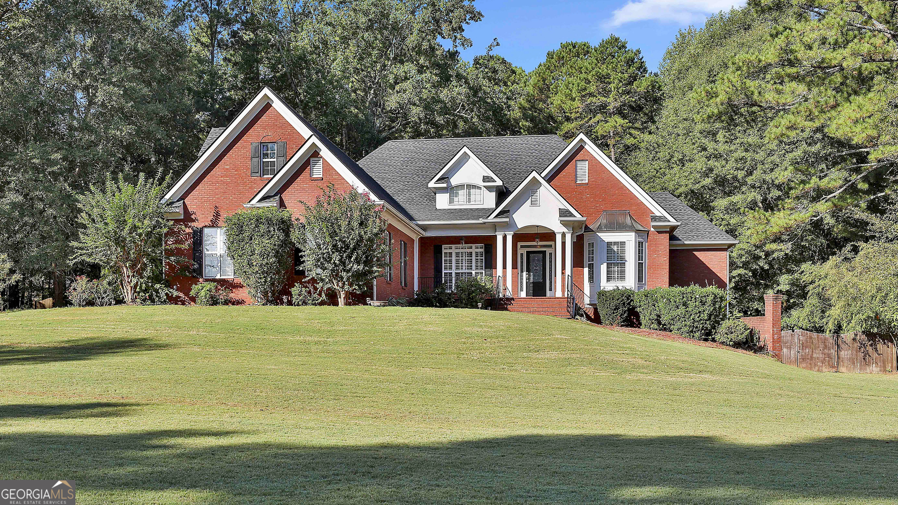 a front view of a house with a yard