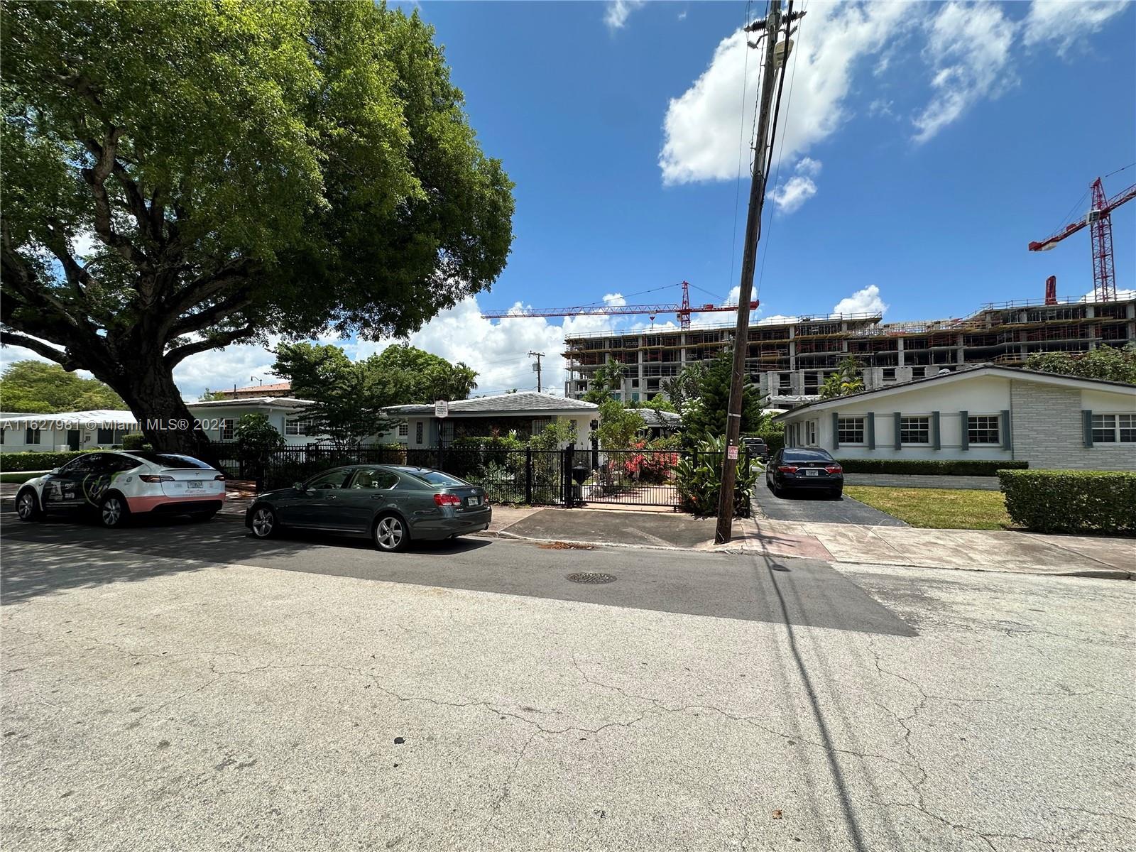 a view of a street with cars