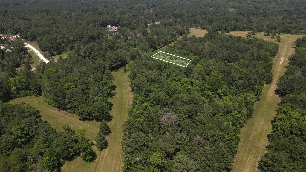 an aerial view of a house with lots of trees