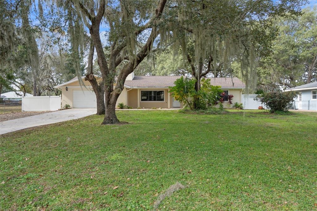 a view of house with yard