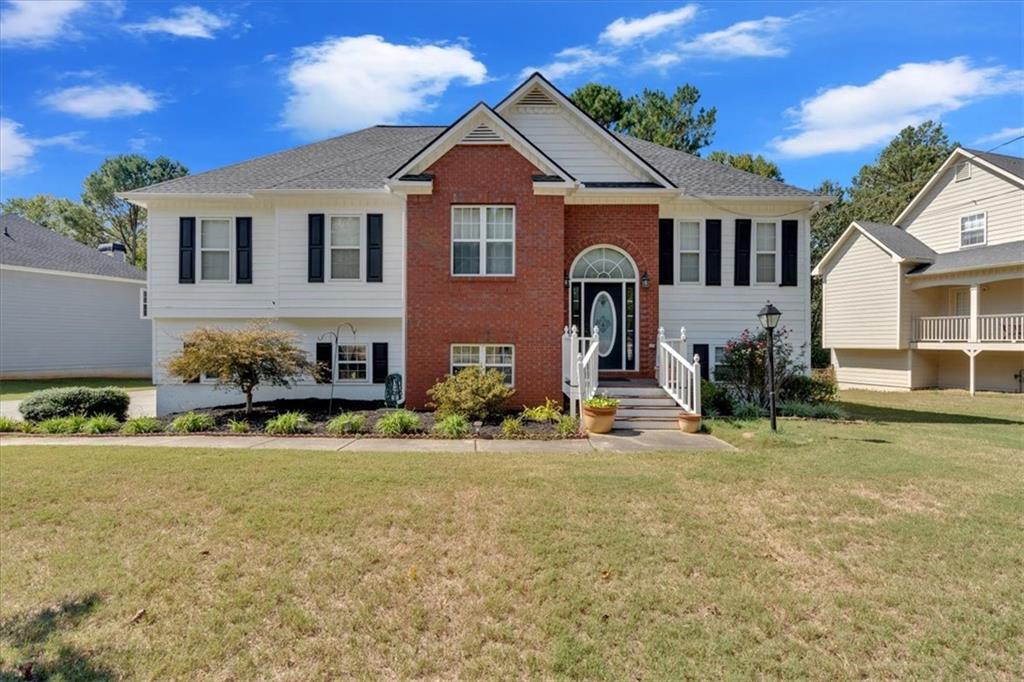 a front view of a house with a yard