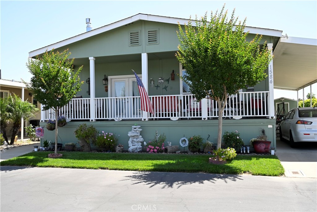 a front view of a house with garden