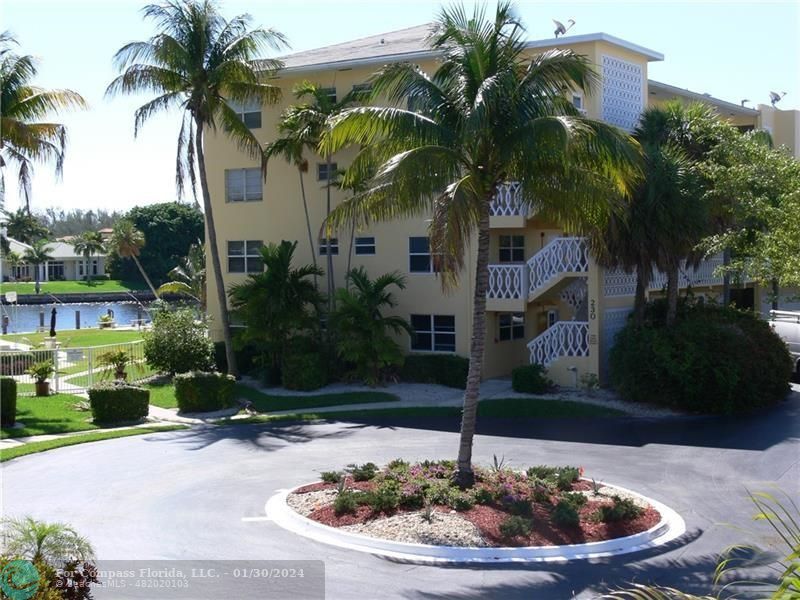 a house with palm tree in front of it