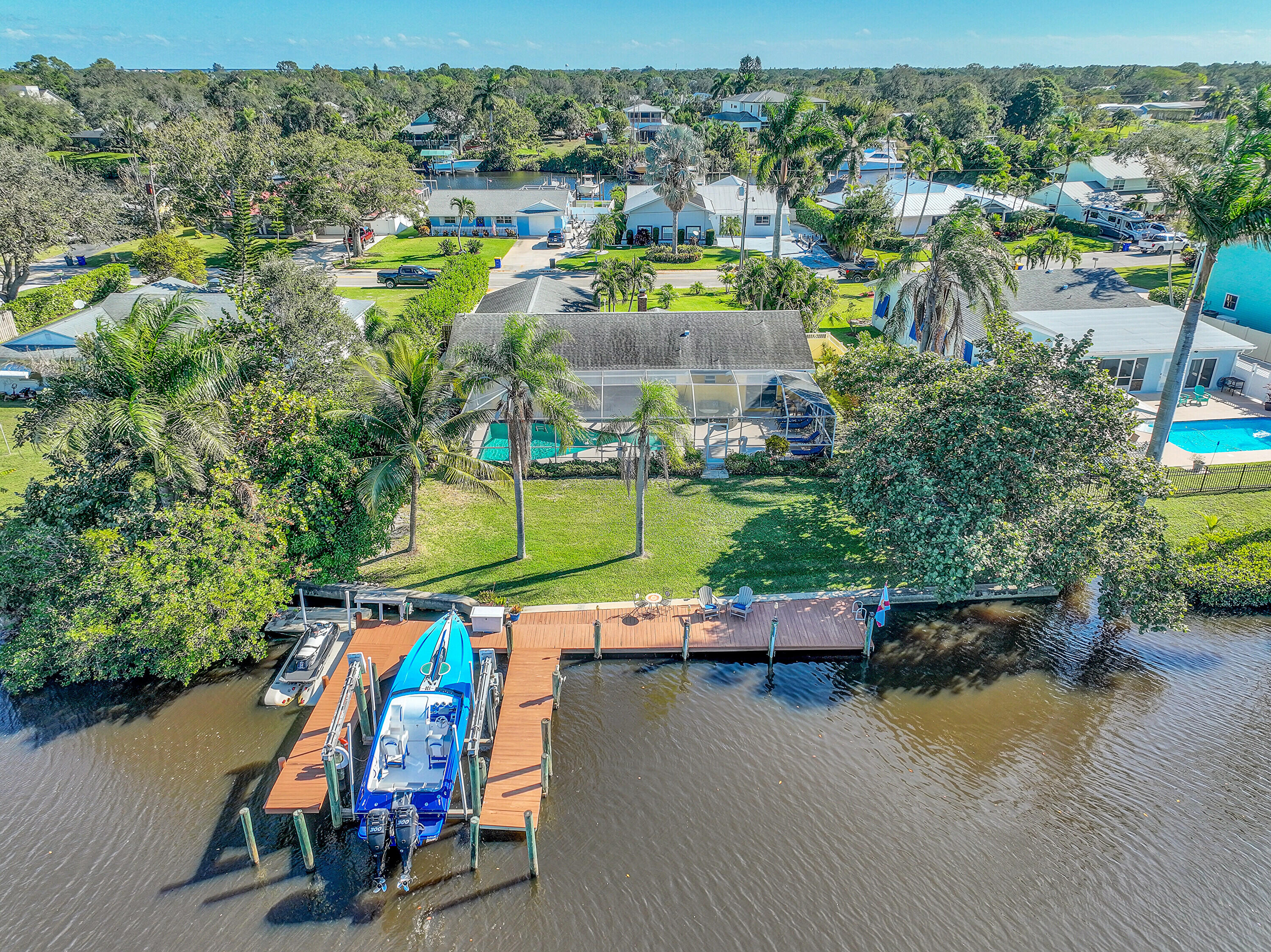 an aerial view of a house with a lake view