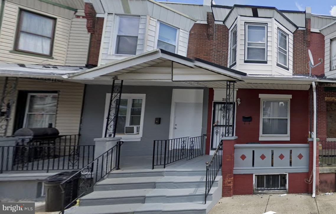 a front view of residential houses with stairs