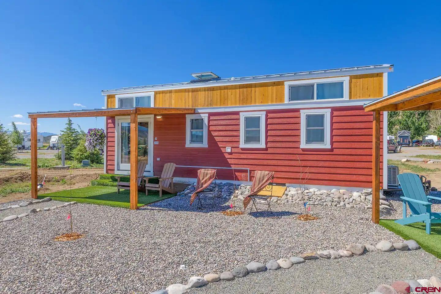 a backyard of a house with barbeque oven