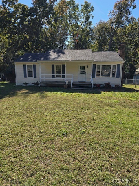 a front view of a house with yard and trees