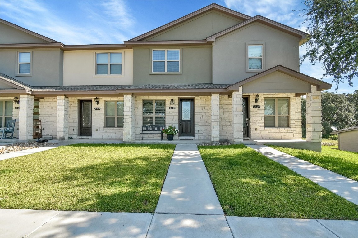 a front view of a house with a yard