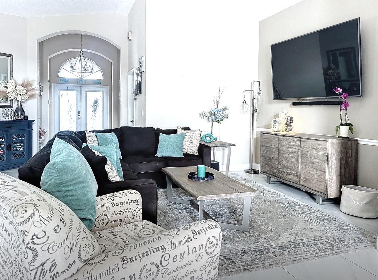 a living room with furniture and a flat screen tv