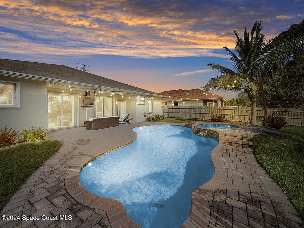 a view of a swimming pool with a patio