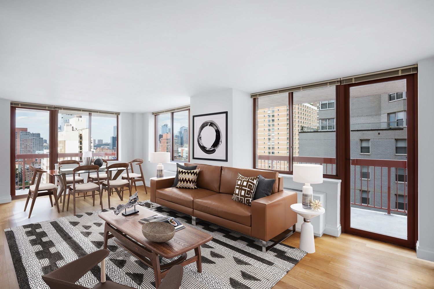 a living room with furniture and large windows