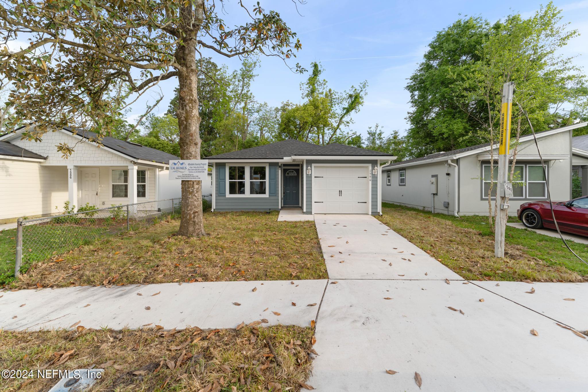 front view of a house with a yard