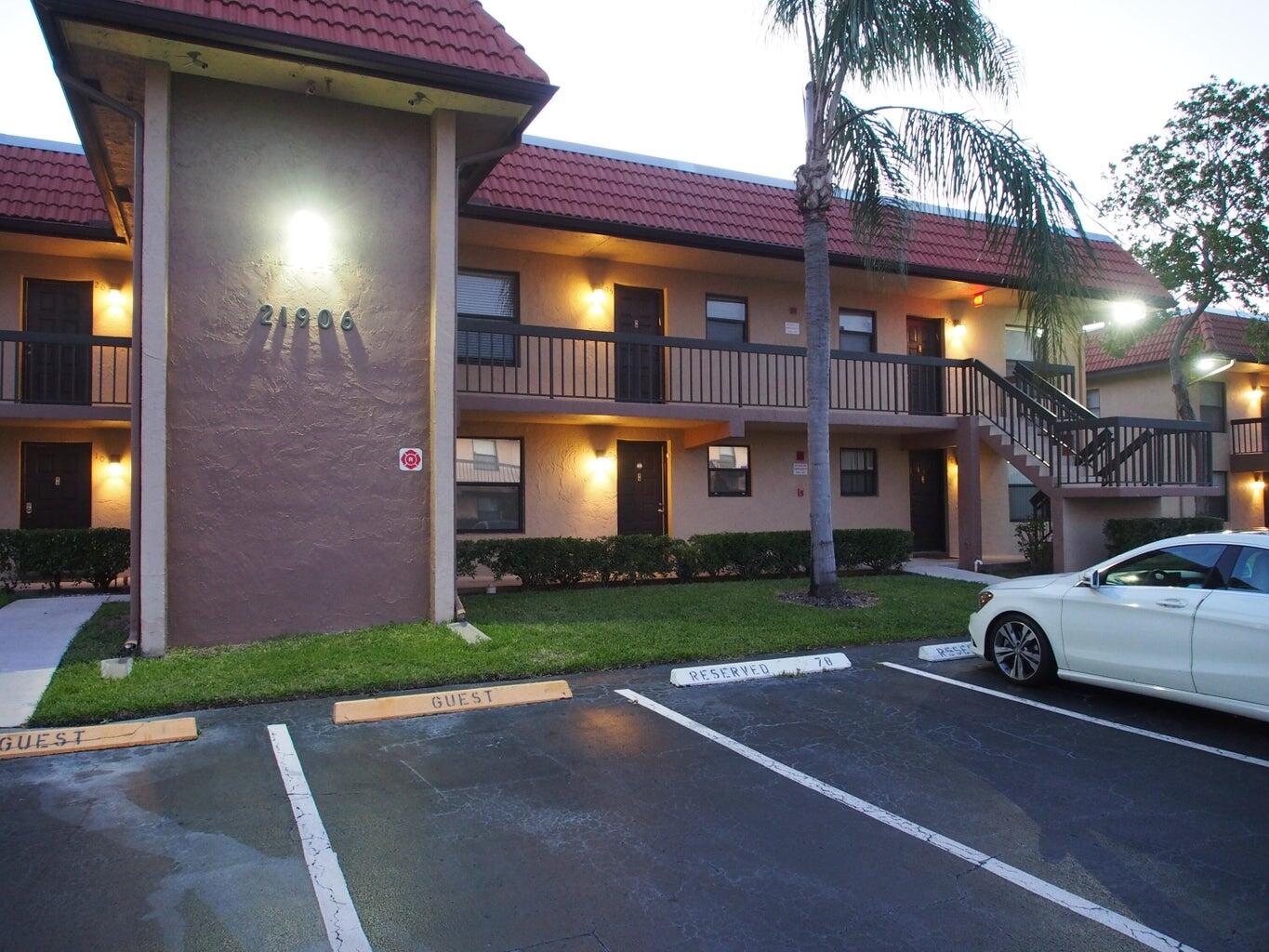 a view of a building with a yard