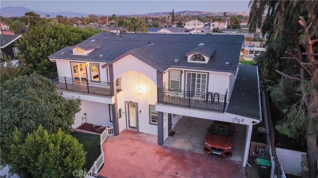 an aerial view of a house with a garden space