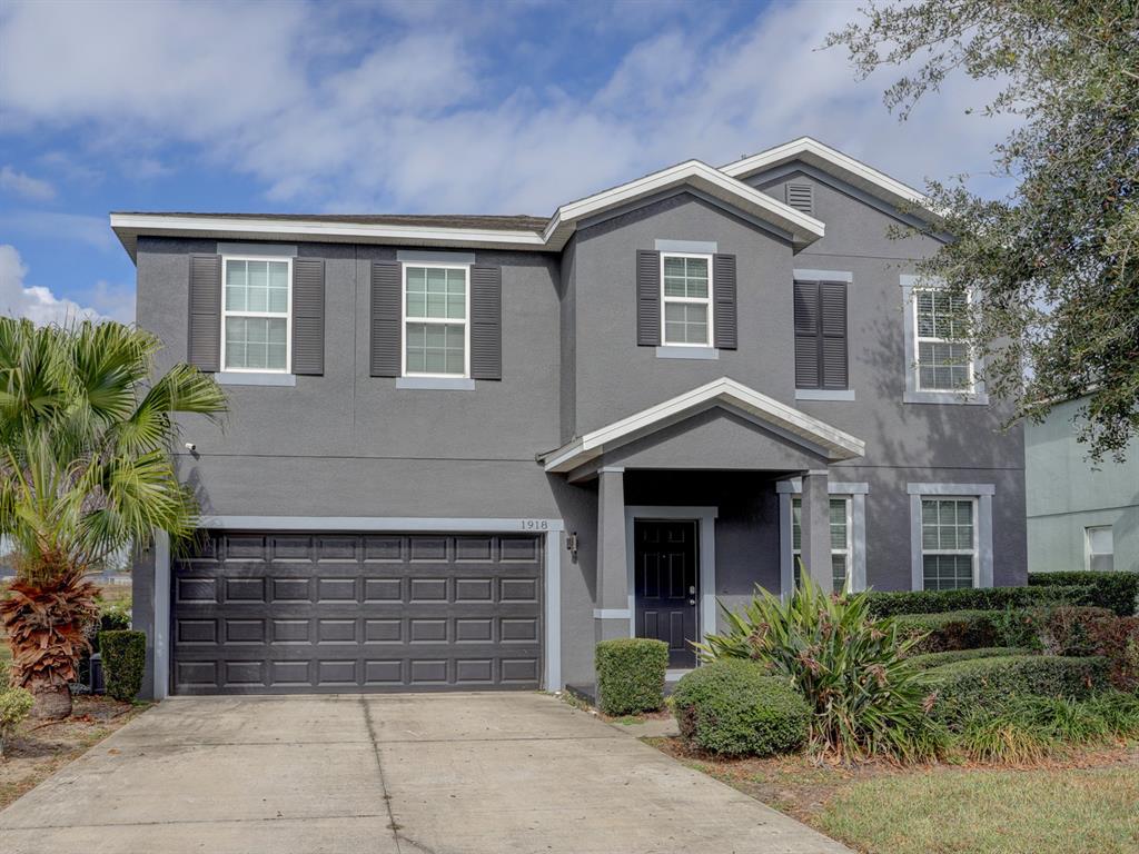 Front of the home with a 2 car enclosed garage.