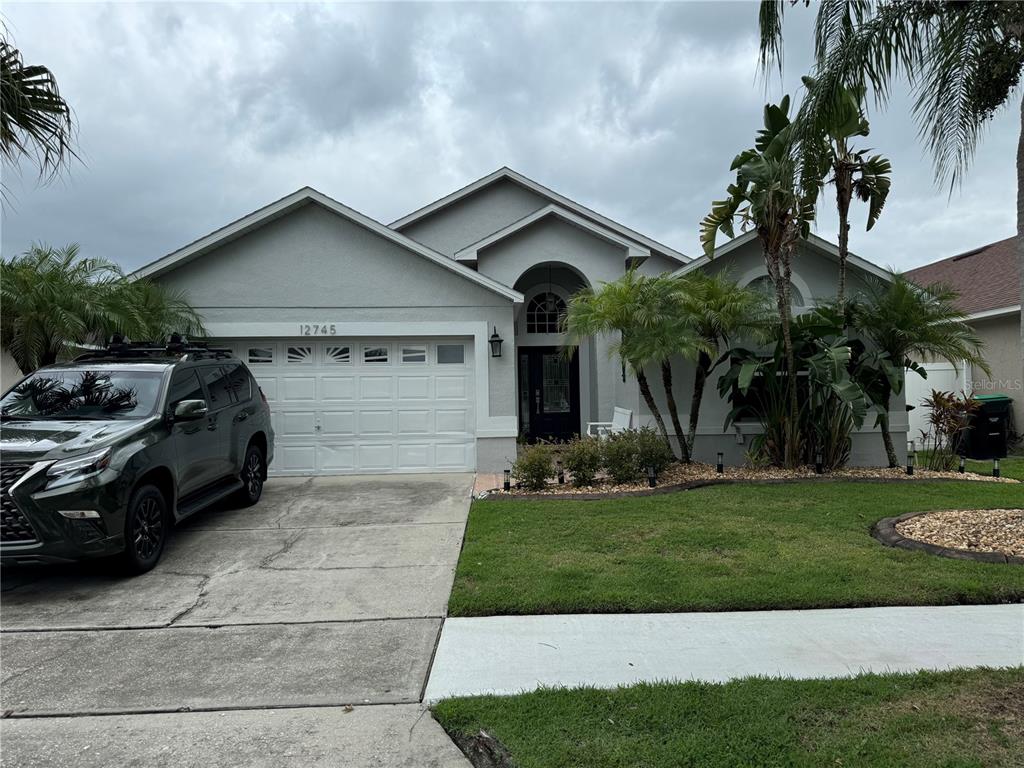 a front view of a house with a yard