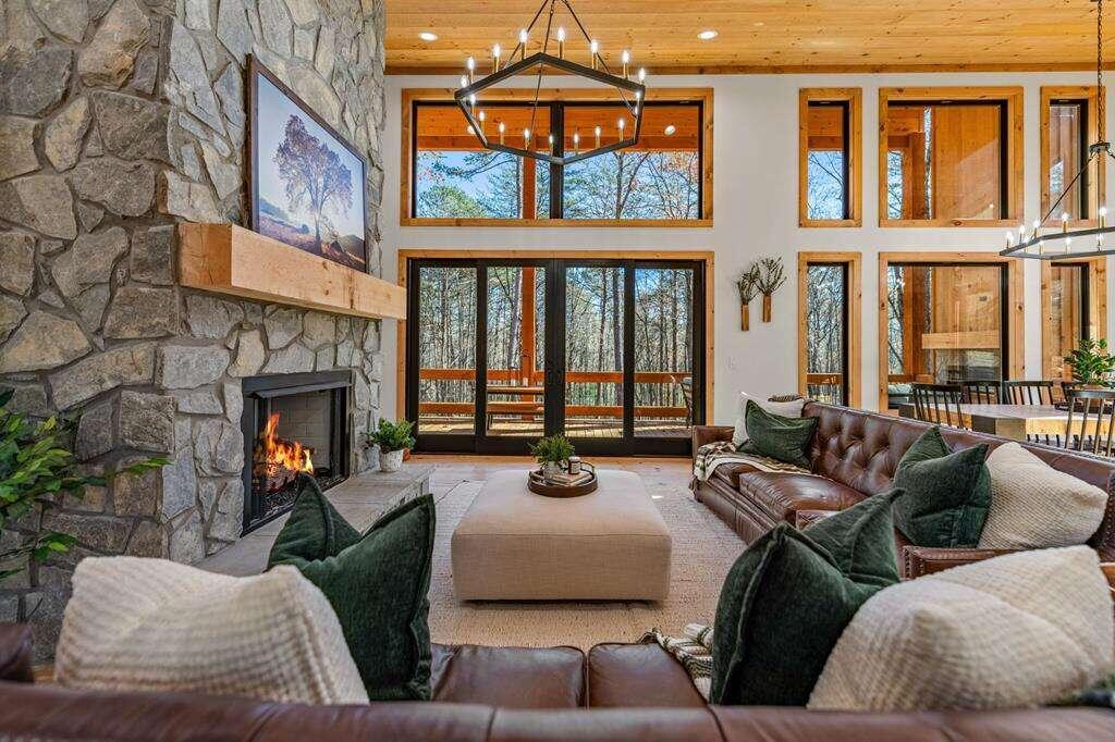 a living room with furniture fireplace and flat screen tv