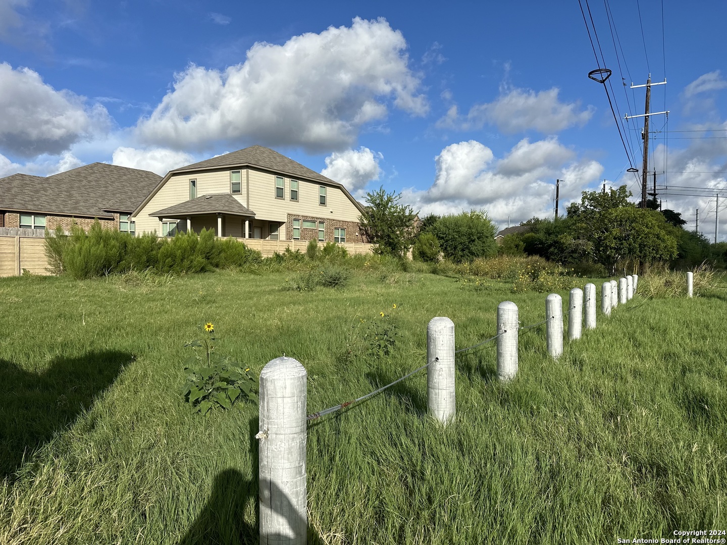 a view of a lake with a yard