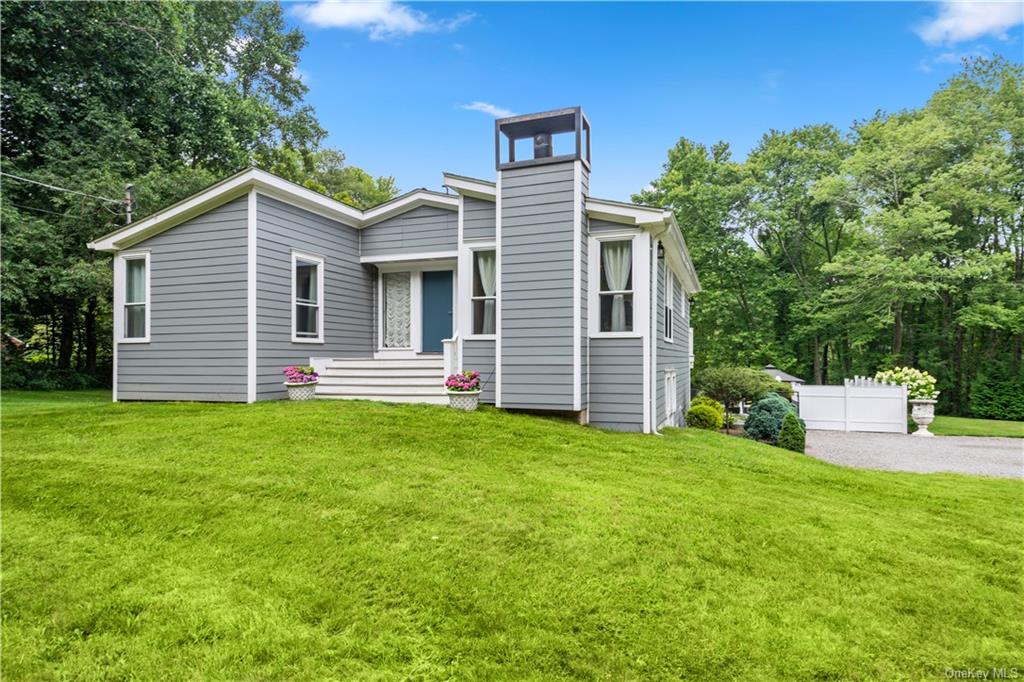 View of front of property featuring a front lawn