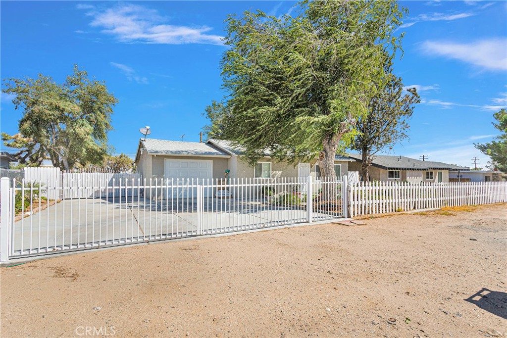 a view of a wooden fence next to a house