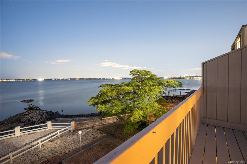 a view of a lake from a balcony