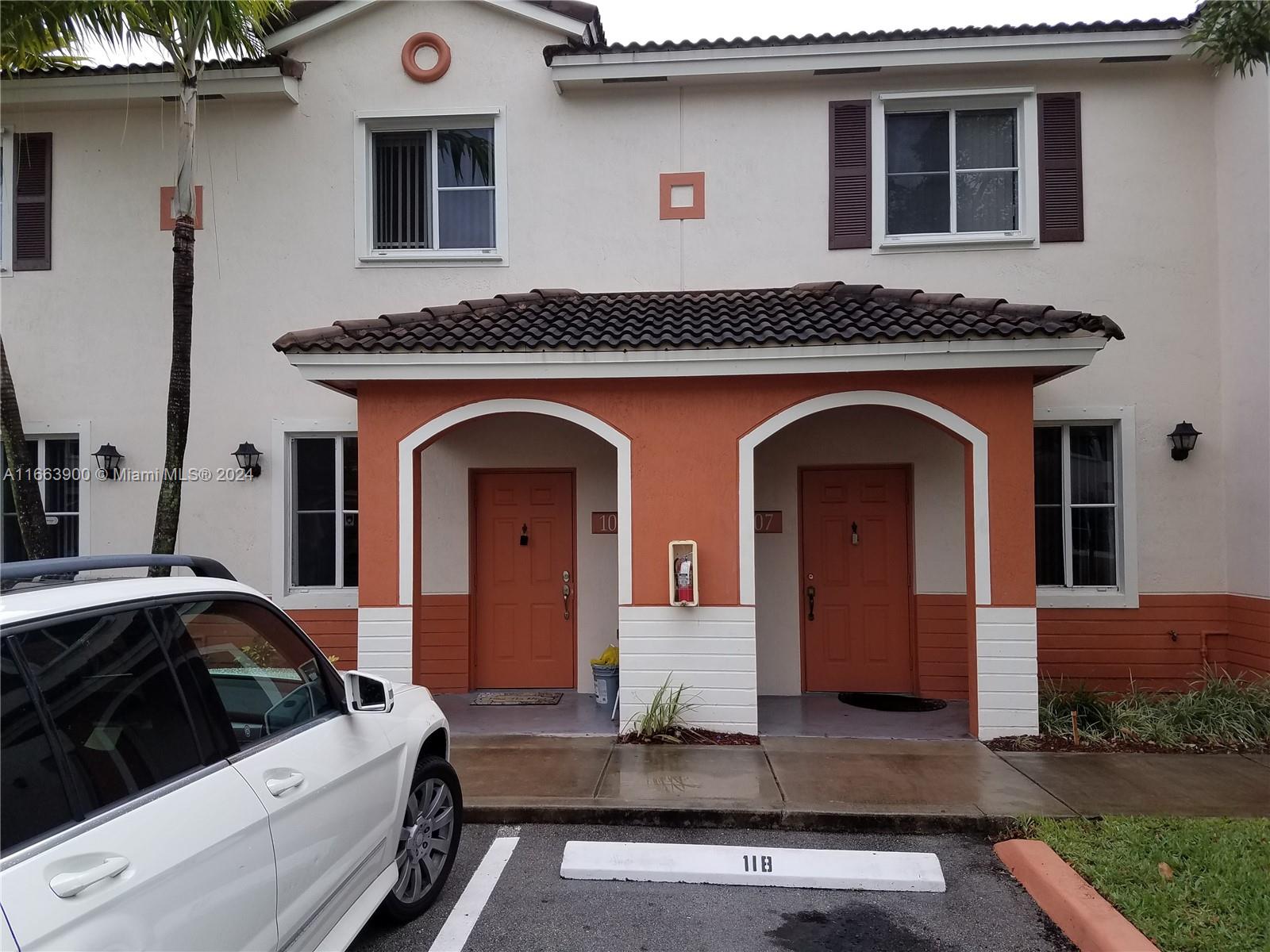 a front view of a house with parking