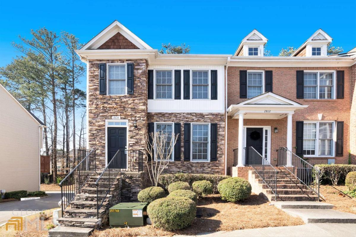 a front view of a house with a yard